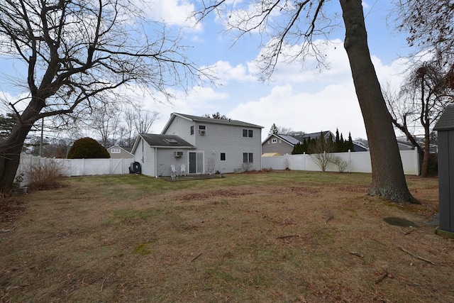 back of property featuring a lawn