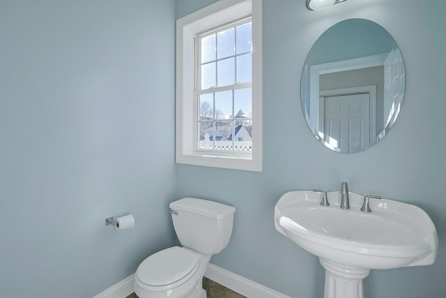 bathroom featuring sink and toilet