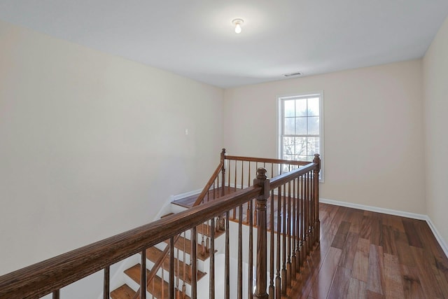 corridor featuring dark hardwood / wood-style floors