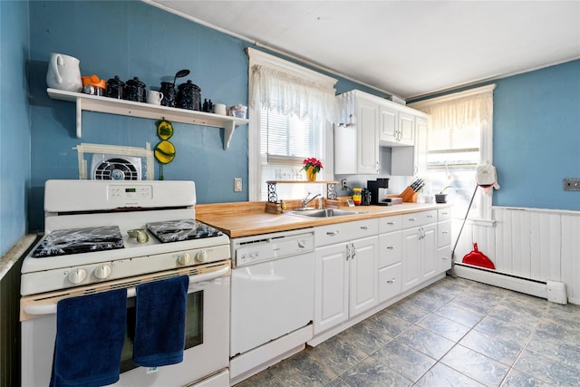 kitchen with white cabinetry, a baseboard heating unit, white appliances, and sink