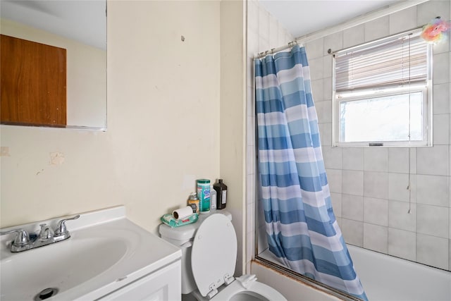 full bathroom featuring vanity, shower / bath combination with curtain, and toilet