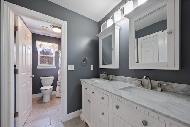 79 Victor Dr, Poughkeepsie, NY 12603 - full bath with toilet, a sink, double vanity, and baseboards