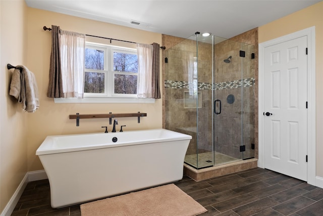 79 Victor Dr, Poughkeepsie, NY 12603 - bathroom with baseboards, wood tiled floor, and a stall shower