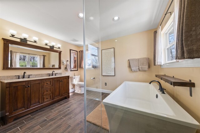 79 Victor Dr, Poughkeepsie, NY 12603 - bathroom with a wealth of natural light, wood finished floors, baseboards, and a sink