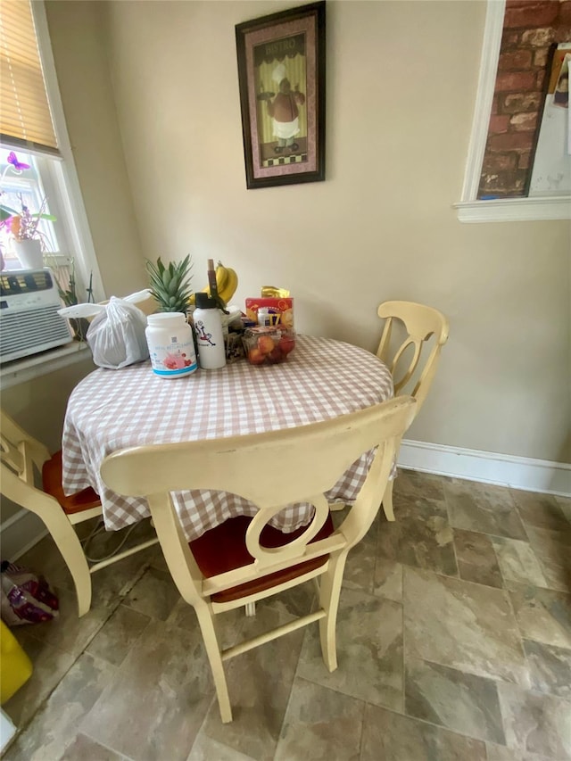 dining space featuring cooling unit