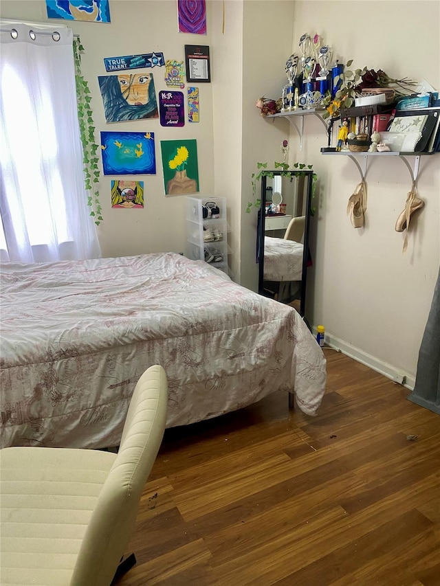 bedroom featuring dark hardwood / wood-style floors