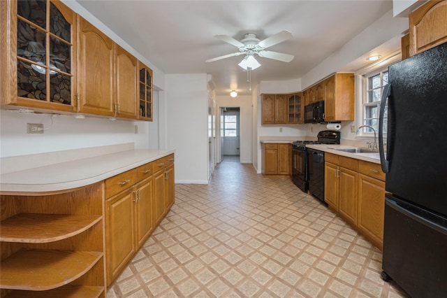 kitchen with sink, ceiling fan, and black appliances