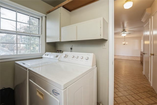 laundry room featuring cabinets, ceiling fan, and washer and clothes dryer