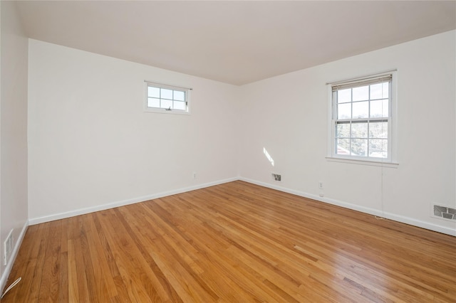 unfurnished room featuring light wood-type flooring