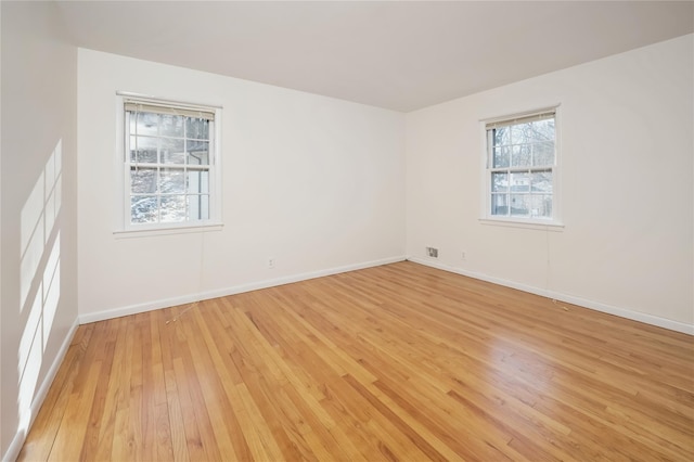 unfurnished room featuring light wood-type flooring