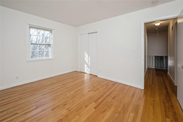 spare room featuring light wood-type flooring