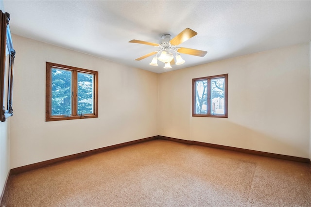 carpeted empty room with ceiling fan