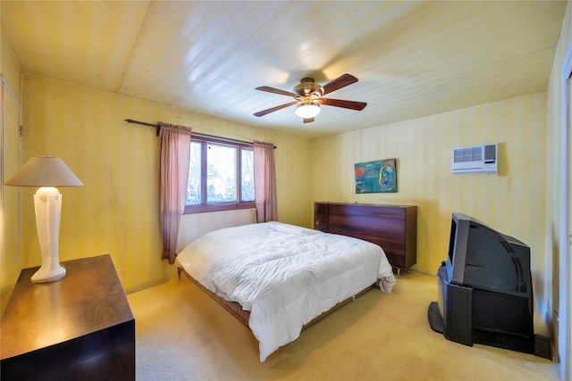 bedroom featuring light carpet, a wall mounted AC, and ceiling fan