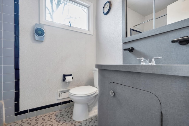 bathroom featuring tile patterned floors and toilet