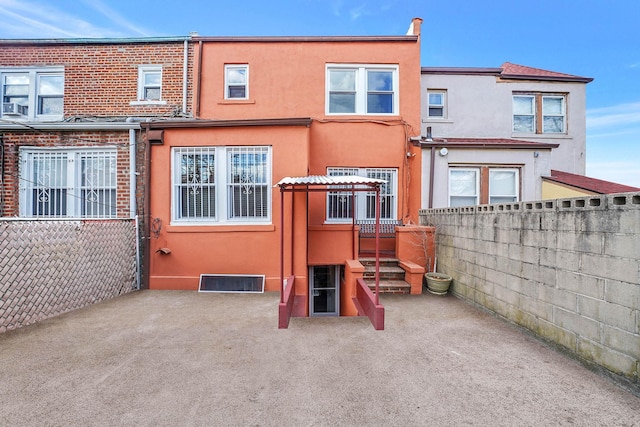 rear view of property featuring a patio