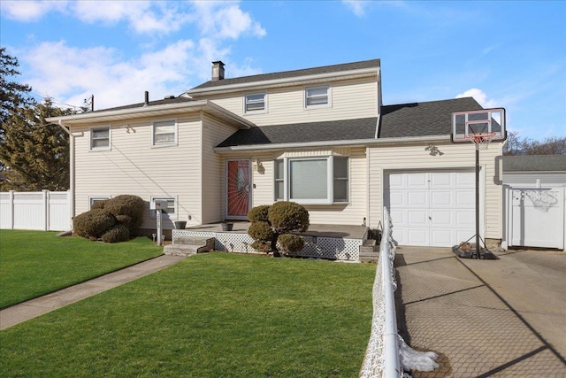 view of front of house with a garage and a front yard