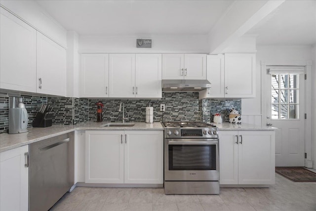 kitchen featuring stainless steel appliances, sink, and white cabinets