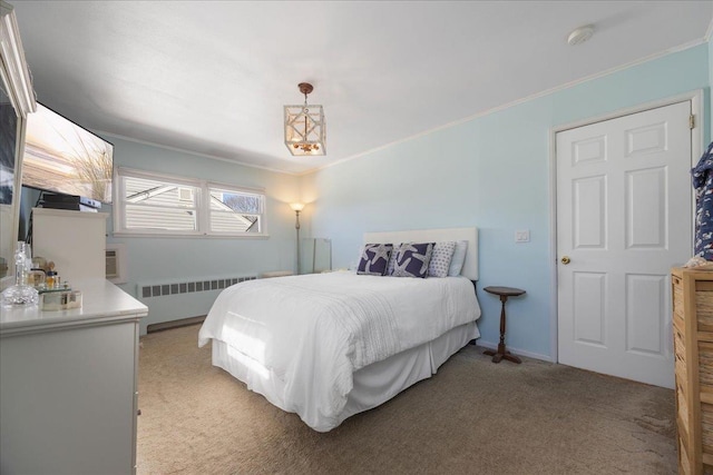 bedroom featuring crown molding, radiator heating unit, and light colored carpet