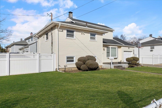 view of side of home featuring a yard