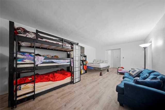 bedroom with hardwood / wood-style flooring