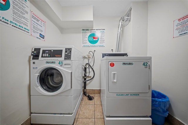 laundry area featuring light tile patterned flooring and independent washer and dryer