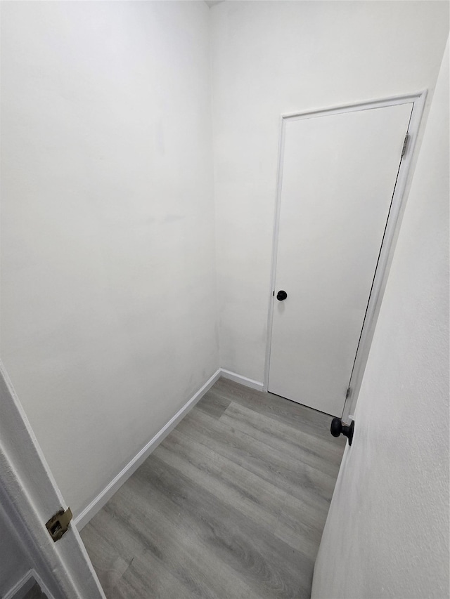 empty room with light hardwood / wood-style flooring