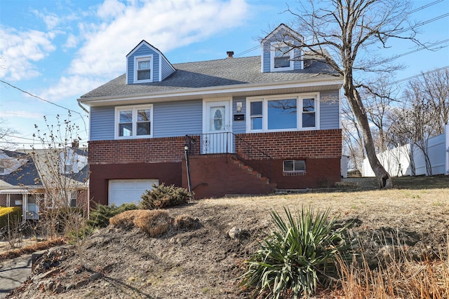 view of front of property with a garage