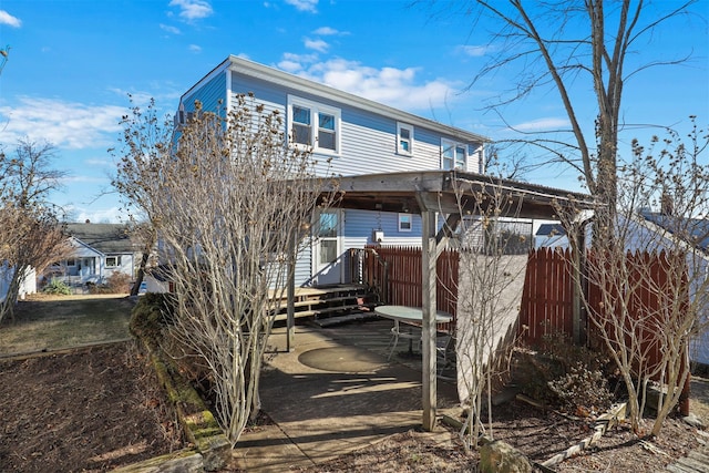 back of property with a patio area