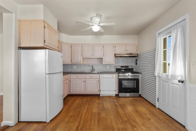 kitchen with tasteful backsplash, ceiling fan, light hardwood / wood-style floors, light brown cabinets, and white appliances