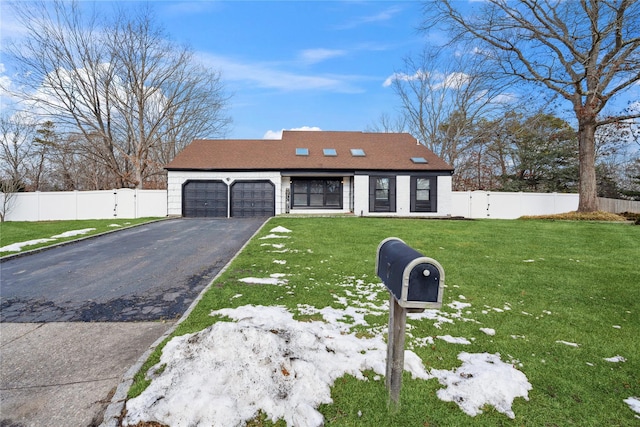 view of front of property with a garage and a front lawn