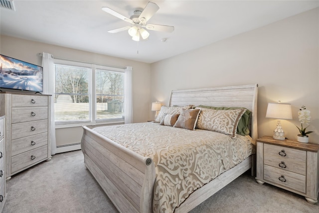 bedroom featuring light carpet, ceiling fan, and baseboard heating