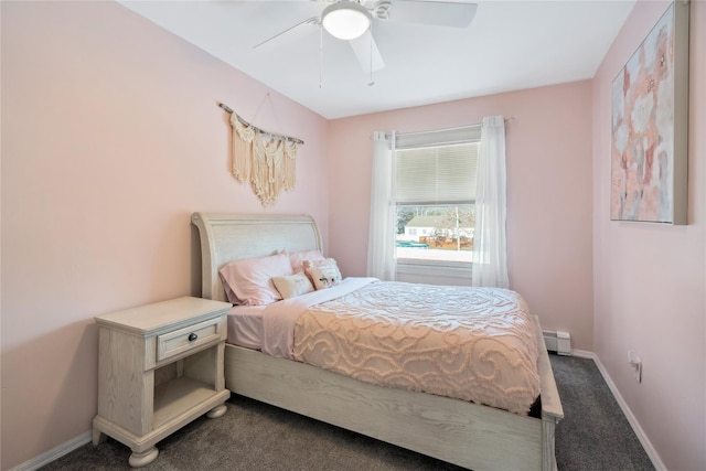 bedroom featuring ceiling fan, a baseboard radiator, and dark carpet