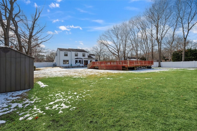 view of yard with a storage unit and a deck