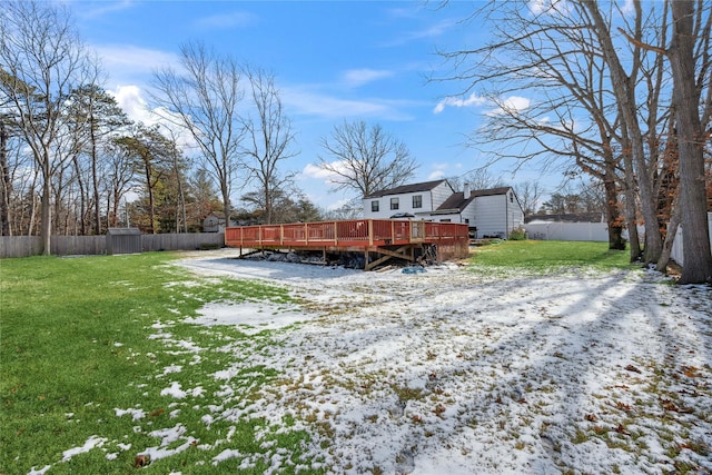 yard layered in snow featuring a wooden deck