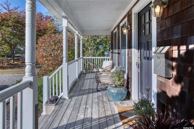 wooden deck featuring covered porch