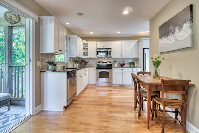 kitchen featuring sink, stainless steel appliances, and white cabinets