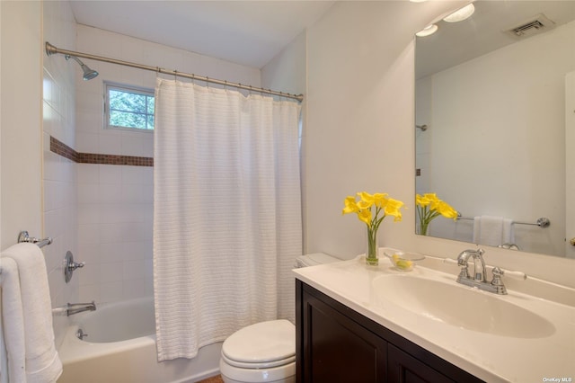 full bathroom featuring shower / tub combo with curtain, vanity, and toilet