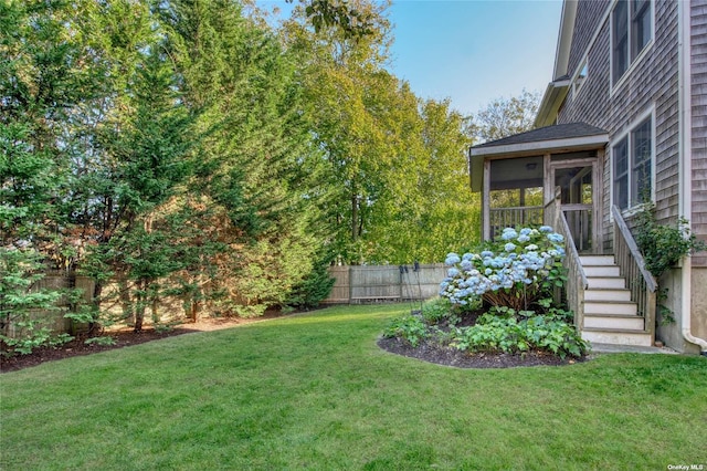 view of yard featuring a sunroom