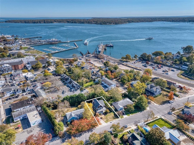 birds eye view of property featuring a water view