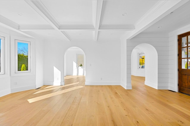 unfurnished living room with ornamental molding, coffered ceiling, beam ceiling, and light hardwood / wood-style floors