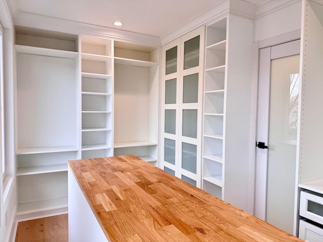 132 Arthur St, Garden City, NY 11530 - walk in closet with wood finished floors