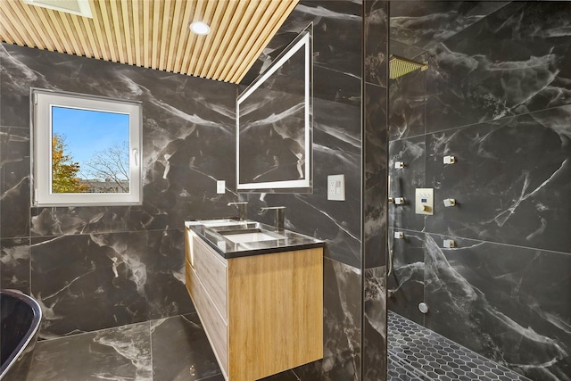 132 Arthur St, Garden City, NY 11530 - bathroom featuring a marble finish shower, vanity, tile walls, and marble finish floors