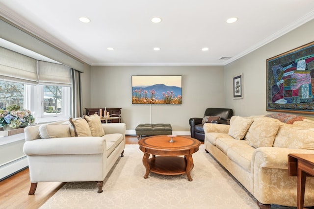 living room with crown molding, a baseboard radiator, and light wood-type flooring