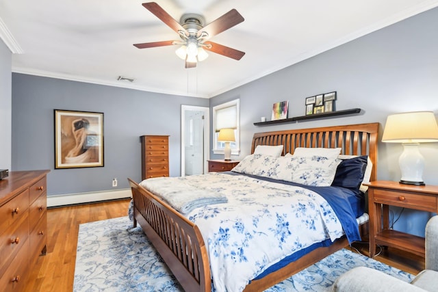 bedroom with a baseboard heating unit, crown molding, light hardwood / wood-style floors, and ceiling fan