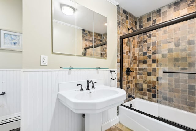 bathroom with sink and shower / bath combination with glass door