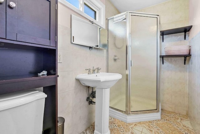 bathroom with tile walls, an enclosed shower, tile patterned flooring, and toilet