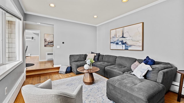 living room with crown molding, radiator, hardwood / wood-style flooring, and a baseboard heating unit