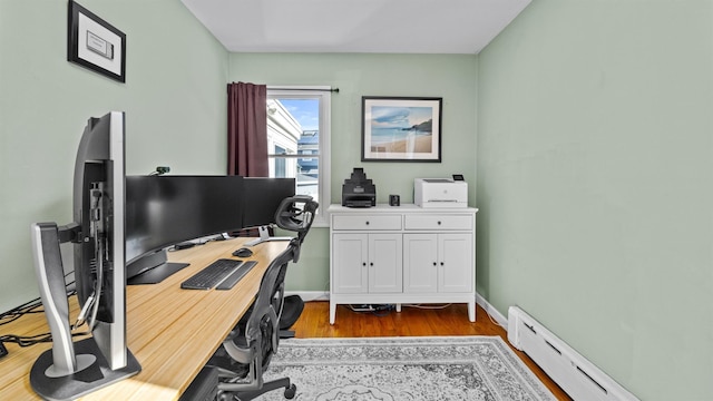 office with baseboard heating and light wood-type flooring