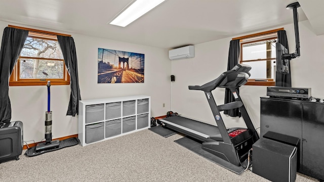 exercise room featuring a wall mounted air conditioner and carpet