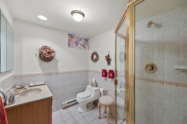 bathroom featuring tile patterned flooring, vanity, a baseboard heating unit, an enclosed shower, and toilet